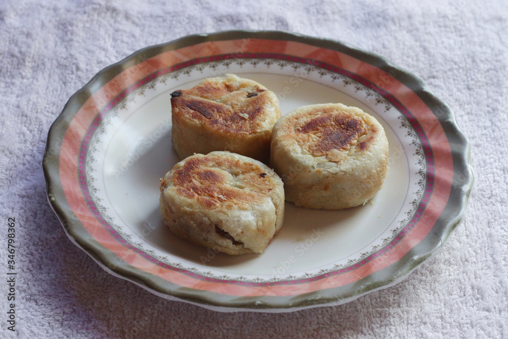 Hopia, a favorite filipino merienda or snack. Made of thin pastry, traditionally filled with mung bean paste. Selective Focus. Hopia, a favorite filipino merienda or snack. Made of thin pastry, traditionally filled with mung bean paste. Selective Focus.