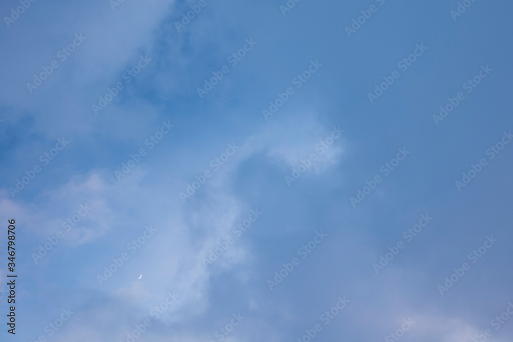 the dark evening sky with moon and thick heavy clouds. Background with copy space for text