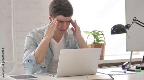 Upset Young Man Reacting to Failure of Project