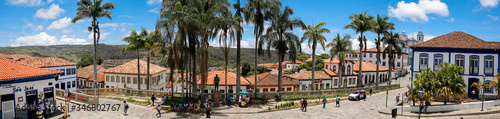 Panorama of traditional houses and palm tree lined street in historic center of Diamantina on a sunny day, Minas Gerais, Brazil
 photo
