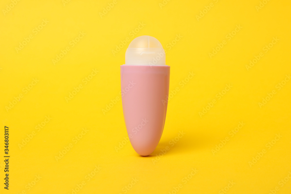 Body antiperspirant deodorant roll-on on yellow background, space for text Body antiperspirant deodorant roll-on on yellow background, space for text