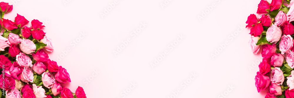 Fototapeta premium Pink Holiday banner. Bouquet of pink and red roses on pink background. Mother's day, Valentines Day, Birthday celebration concept. Copy space, top view