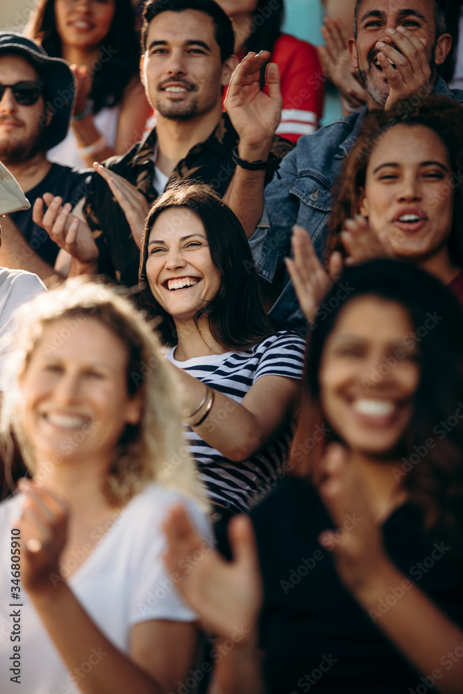 Crowd of sports fans cheering during a match Crowd of sports fans cheering during a match