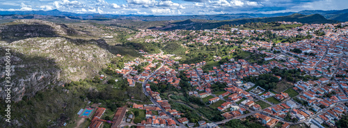 Panoramic aerial view with sunshine, shadow, cloudy sky of the east part of historic town Diamantina and valley, Minas Gerais, Brazil  © Uwe Bergwitz