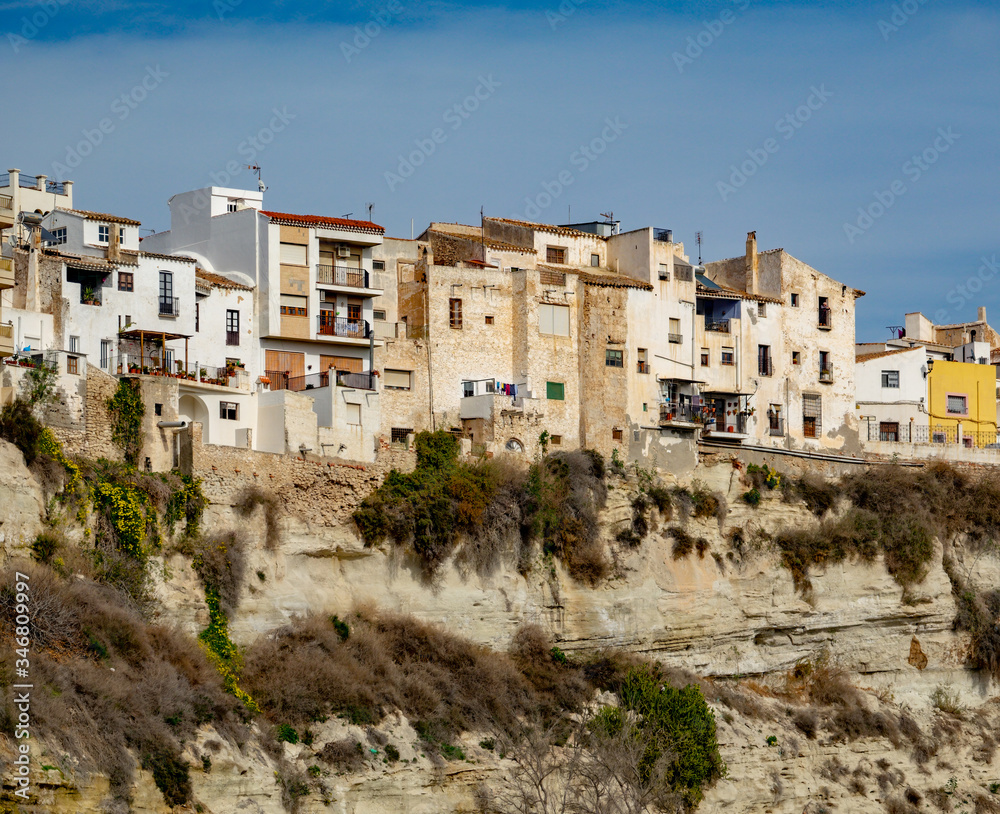 Residential buildings on the edge of high rock in Sorbas, Spain.
