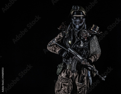 Nuclear post apocalypse life after doomsday concept. Grimy survivor with homemade weapons. Studio portrait