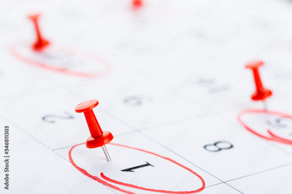 2020 calendar page marked with an important date in red pin. timeline, time, concept, idea, management 2020 calendar page marked with an important date in red pin. timeline, time, concept, idea, management