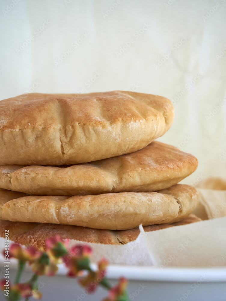 A stack of pita bread on a white background - fresh baked gluten-free pita bread A stack of pita bread on a white background - fresh baked gluten-free pita bread