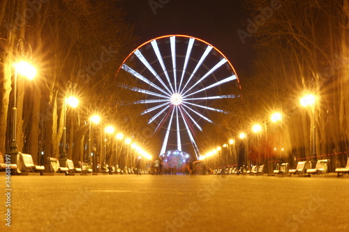 Big ferris wheel at night in the city 