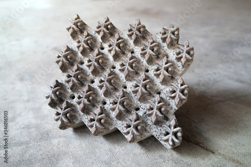 Indian wooden block used for handmade textile printing in Bagru village, Jaipur, India.