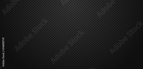 Vector carbon fiber texture. Dark background with lighting.