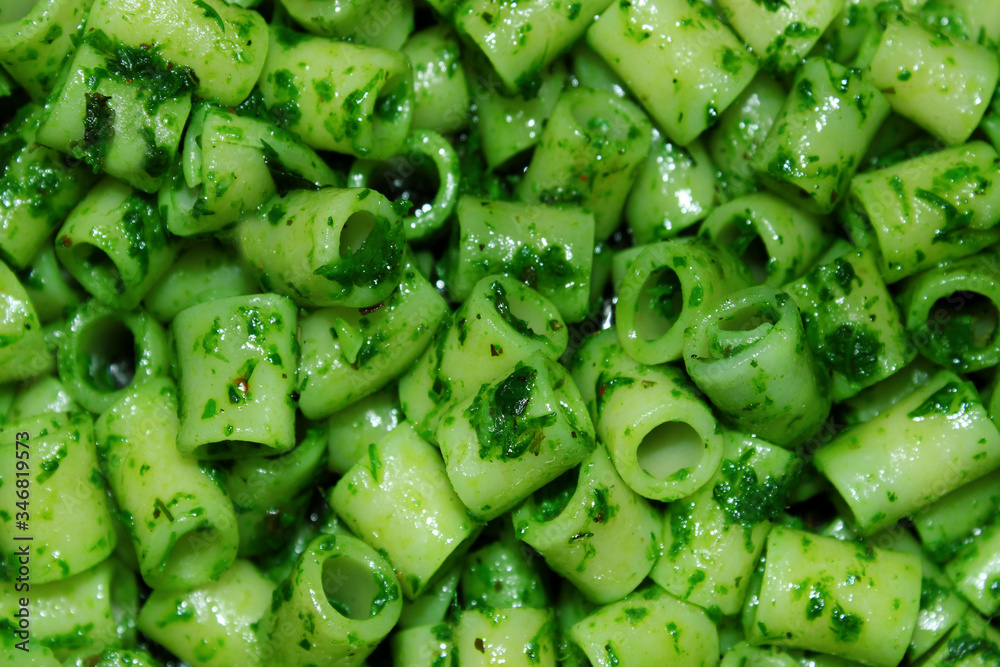 Cropprd shot of green pasta with spinach. Abstract food background. Cropprd shot of green pasta with spinach. Abstract food background.