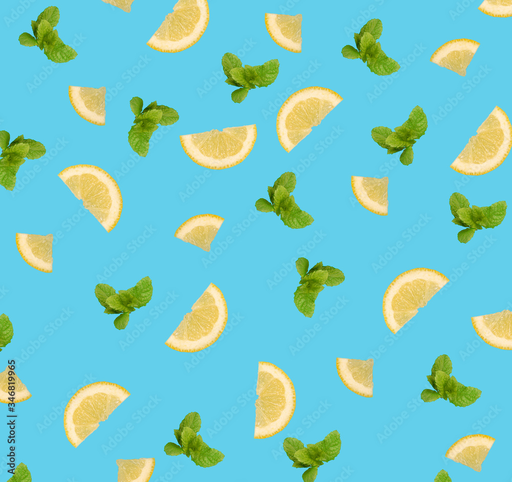 Lemon slices and mint leaves pattern on blue background. Lemon slices and mint leaves pattern on blue background.