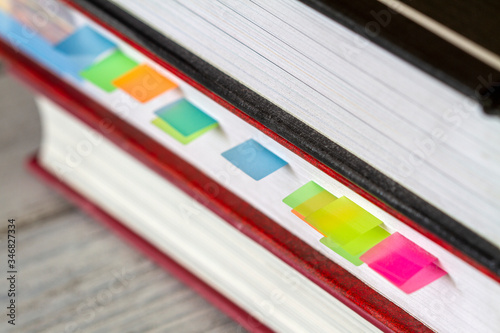Book with colorful bookmarks or memory notes