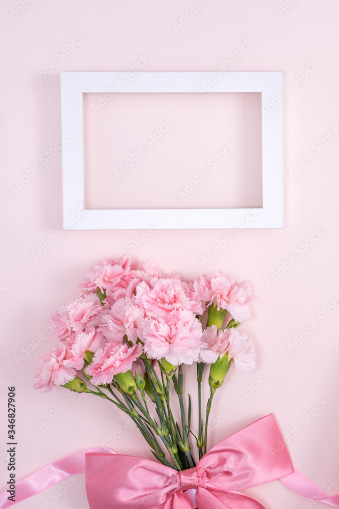 Mother's Day, Valentine's Day background design concept, beautiful pink carnation flower bouquet on pastel pink table, top view, flat lay, copy space. Mother's Day, Valentine's Day background design concept, beautiful pink carnation flower bouquet on pastel pink table, top view, flat lay, copy space.