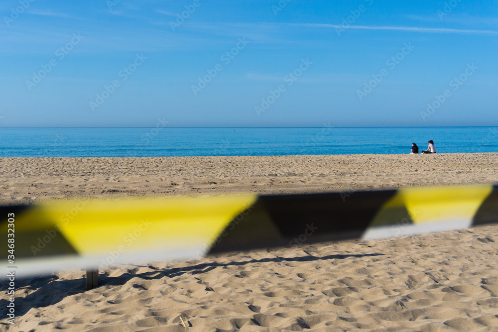 Closed beach because of the coronavirus. 2 women breaks the rule. Lock down concept. Closed beach because of the coronavirus. 2 women breaks the rule. Lock down concept.
