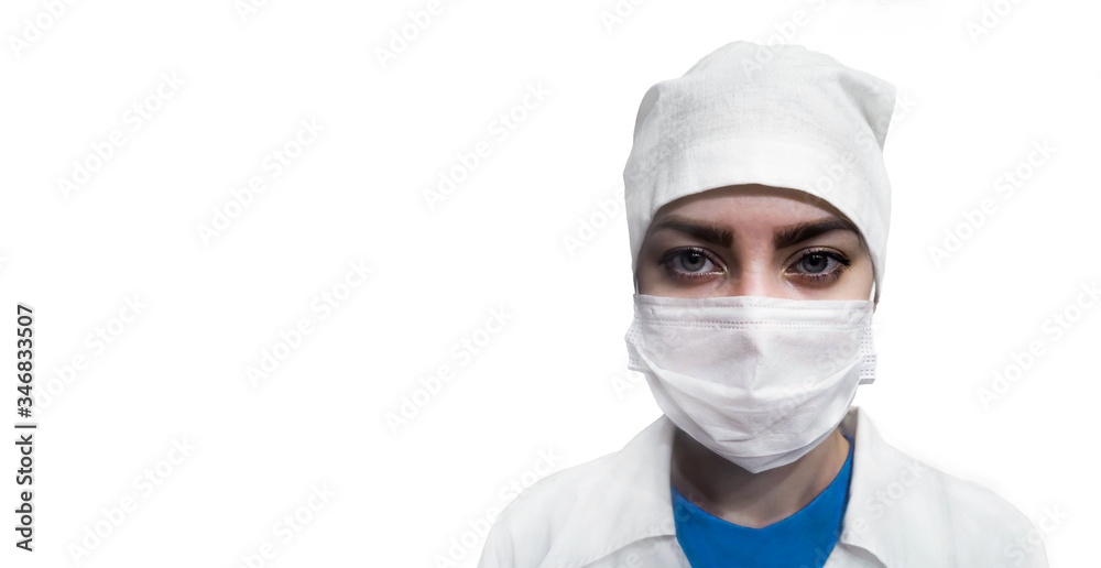 Young female doctor in protective medical mask, medical cap and dressing gown on isolated white background, empty space for your design Young female doctor in protective medical mask, medical cap and dressing gown on isolated white background, empty space for your design