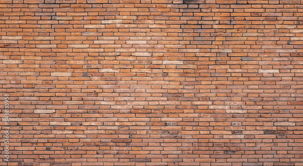 The background of the brick wall with dark orange is beautifully arranged. Ancient wall Grunge background The backdrop may be used in interior design.