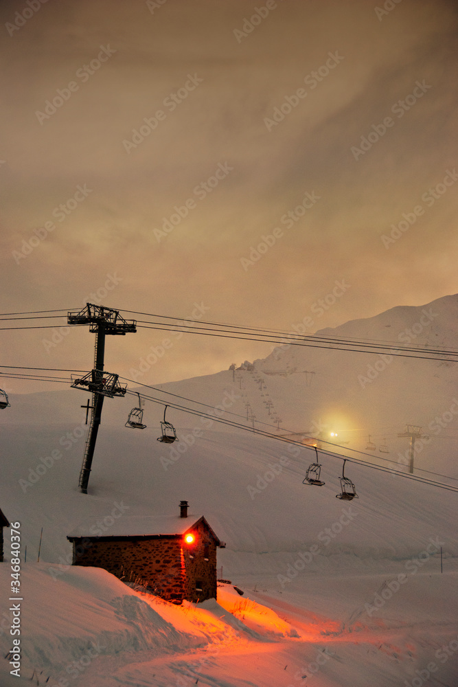 Sun setting over Les Arcs 2000 paradiski ski area Massif de La Vanoise, high Tarentaise valley Savoie France