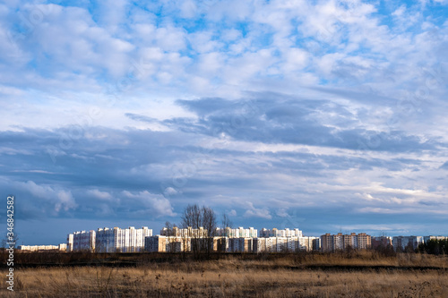 High-rise buildings of the Sukhovka microdistrict in the city of Ivanovo in the rays of the setting sun.