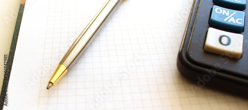 Wallpaper Mural Calculator pen and notebook on white background Torontodigital.ca