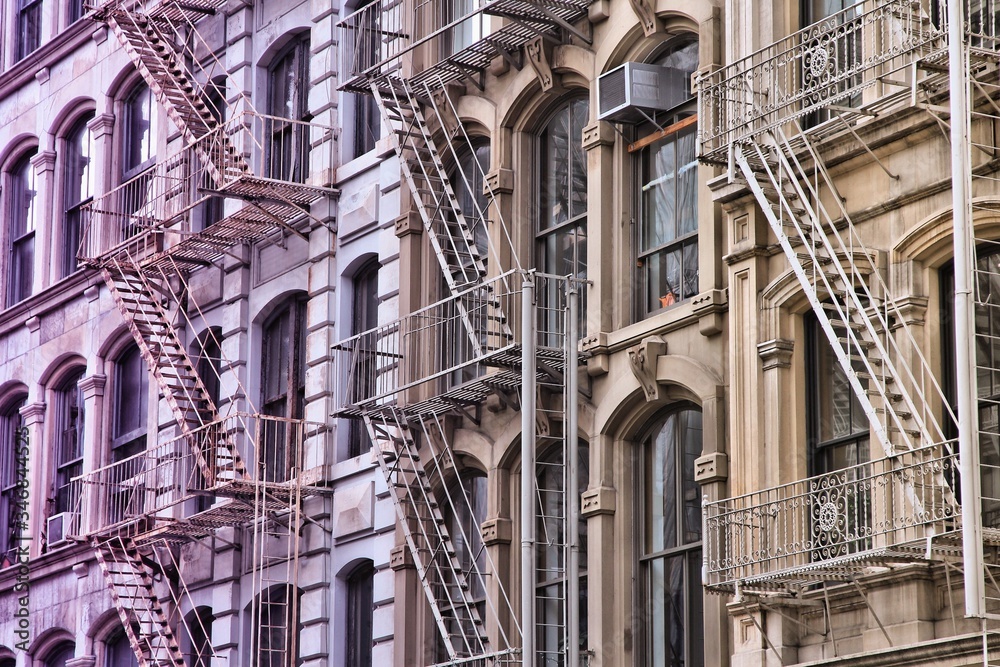 Obraz premium Fire escape stairs in New York City. Filtered image style.