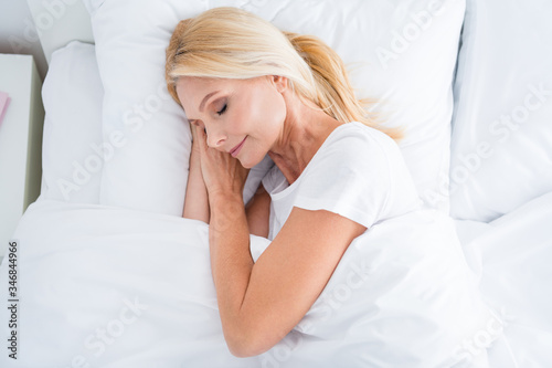 Top above high angle view close-up portrait of her she nice-looking attractive lovely pretty calm aged woman lying in bed sleeping enjoying silence covered white light blanket duvet sheets linen