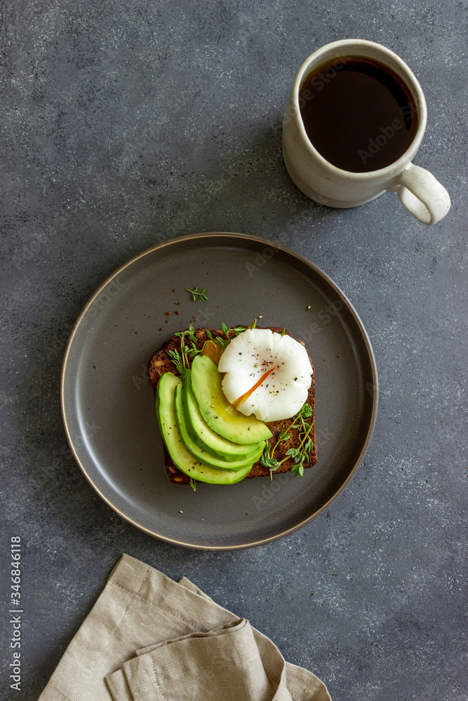 Sandwich with avocado and poached egg. Healthy eating Vegetarian food. Breakfast. Sandwich with avocado and poached egg. Healthy eating Vegetarian food. Breakfast.