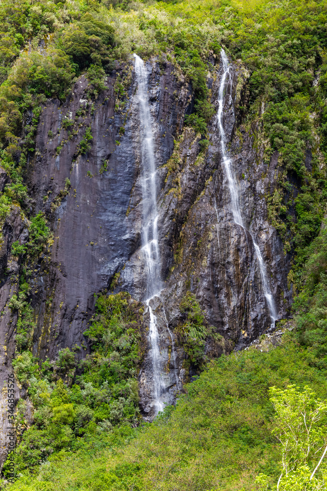 A small double waterfall in New Zealand. A small double waterfall in New Zealand.