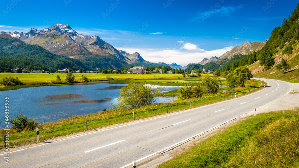 Naklejka premium Clear morning at Lake Sils (Silsersee), in the Upper Engadine Valley (Graubünden, Switzerland). It lies between Lake Silvaplana and the Maloja Pass and is well known for its beauty