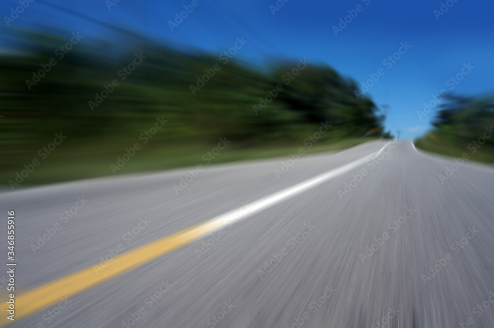 Highway road speed lines yellow and white texture background, radial motion blur / zooming effect. Highway road speed lines yellow and white texture background, radial motion blur / zooming effect.