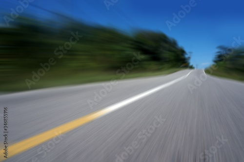 Highway road speed lines yellow and white texture background, radial motion blur / zooming effect.  © sukarman