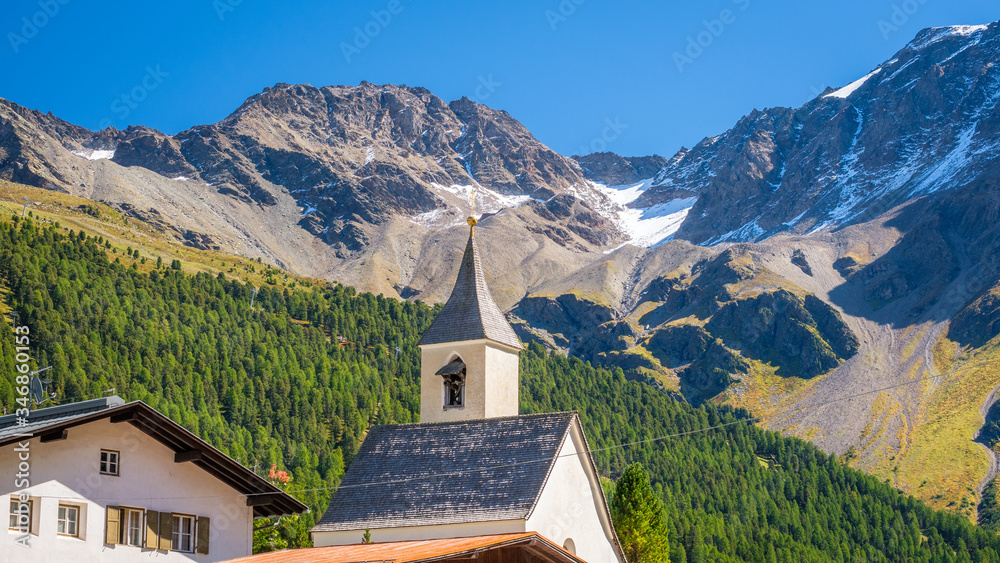 Looking at the church tower of Sulden (Italian: Solda), a mountain village in South Tyrol. Sulden (1,900 m) lies at the foot of the Ortler, in the Vinschgau valley east of the Stelvio Pass.