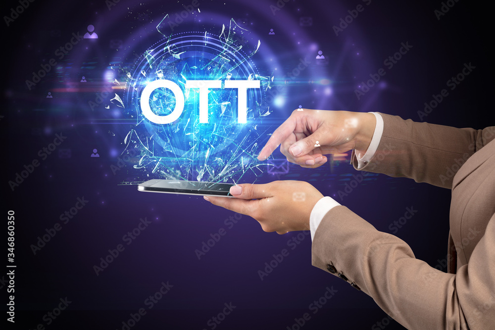 Close-up of a touchscreen with OTT abbreviation, modern technology concept Close-up of a touchscreen with OTT abbreviation, modern technology concept