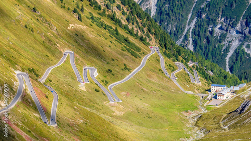 The Stelvio Pass is a mountain pass in the Ortler alps in South Tyrol (Northern Italy) and connects to the Swiss Umbrail pass towards the valley Val Müstair. It has a total of seventy-five hairpin tur photo