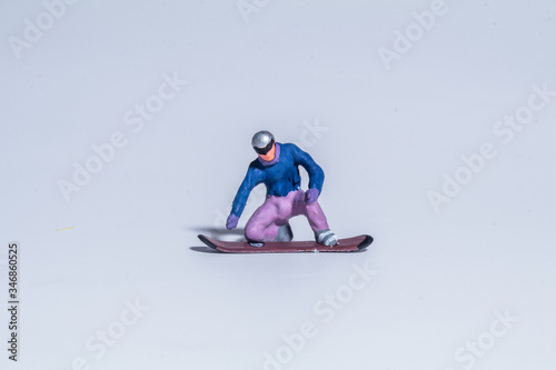 miniature figure concept of snowboarder