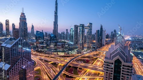 Time lapse Aerial view and top view of traffic on city streets in Dubai. Expressway with car lots. Beautiful roundabout road in the city center.