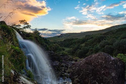 Fototapeta Naklejka Na Ścianę i Meble -  sunset waterfall scenic mountains trees