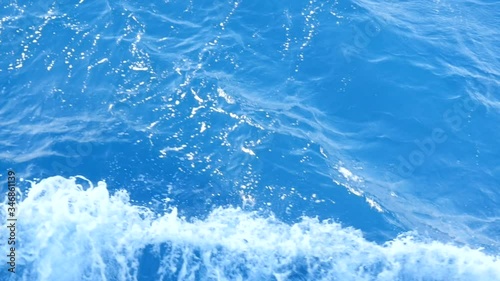 The Sea is not Calm on this Windy Day. The Waves Rock a Small Motor Boat. Sprays of Foam Fly Into the Distance. Beautiful Deep Red Sea in Egypt.