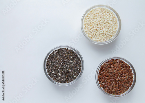 Chia, flax, sesame in glass bowls