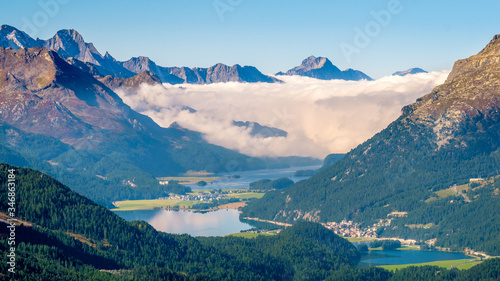 Panoramic view from Muottas Muragl (Graubünden, Switzerland) of the Upper Engadine Valley and the Upper Engadine Lakes Lake Silvaplana and Sils. It is a viewpoint accessible by funicular railway 
