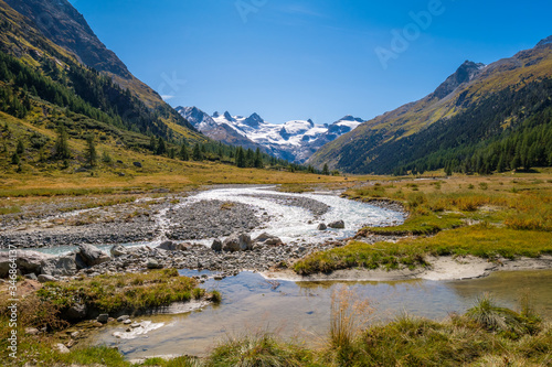 Gorgeous nature of the Roseg Valley in September. It is a valley of the Swiss Alps, located on the north side of the Bernina Range in Graubünden The valley is drained by the Ova da Roseg river.  © Chris