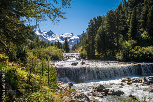 Gorgeous nature of the Roseg Valley in September. It is a valley of the Swiss Alps, located on the north side of the Bernina Range in Graubünden The valley is drained by the Ova da Roseg river. 