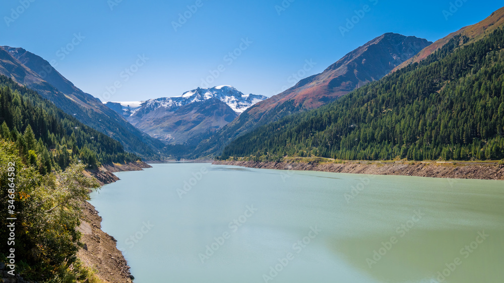 Looking at the gorgeous Gepatsch Reservoir in the Kauner Valley (Tyrol, Austria) at noon. This valley features one of the most beautiful mountain roads, the Kauner Valley Glacier Road.