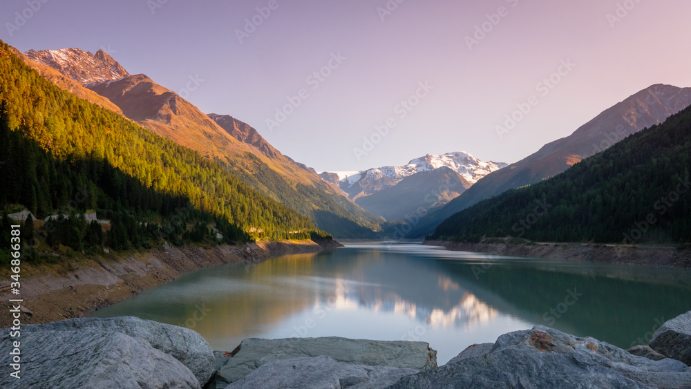 Evening at the gorgeous Gepatsch Reservoir in the Kauner Valley (Tyrol, Austria). This valley features one of the most beautiful mountain roads, the Kauner Valley Glacier Road.