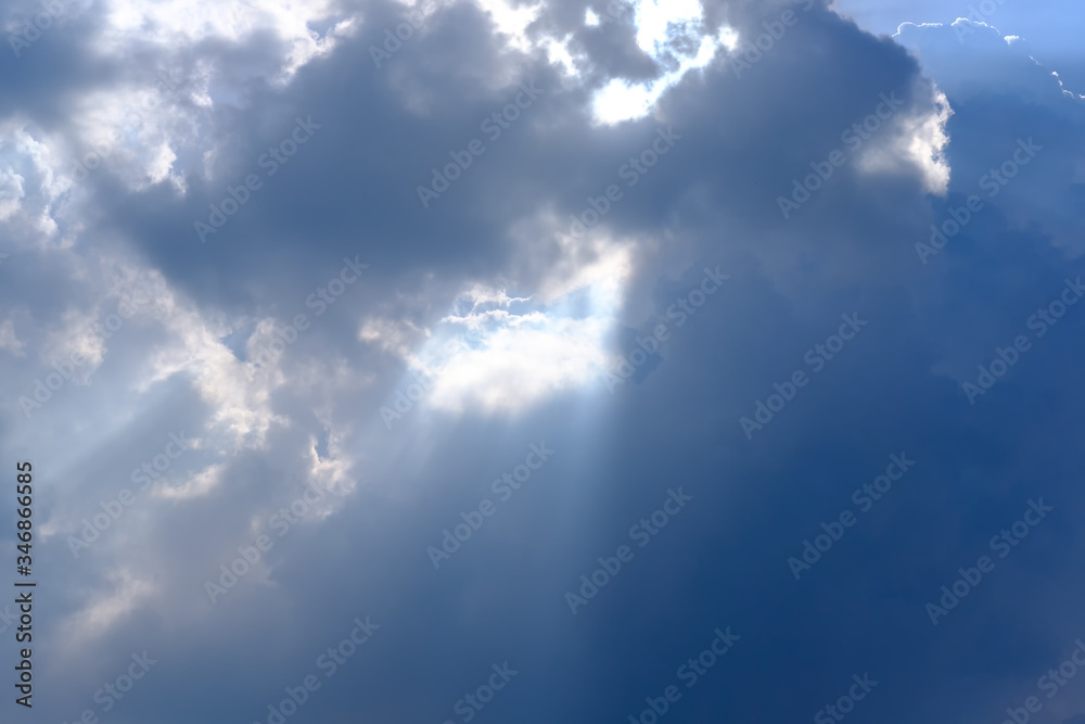 Sunbeam, sunlight through the haze, cloud on the blue sky . Cloud with sun ray. Sunbeam, sunlight through the haze, cloud on the blue sky . Cloud with sun ray.