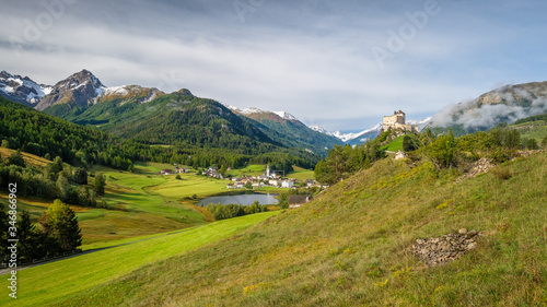 Mountains surrounding Tarasp castle, in the canton of Graubünden (Engadin) Switzerland. Tarasp is a village in Graubünden, Switzerland. The castle is a Swiss heritage site of national significance