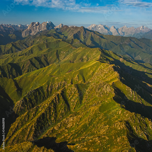 Top drone view of mountainous terrain. Green mountains. Scenic landscape. © Aleks Kend