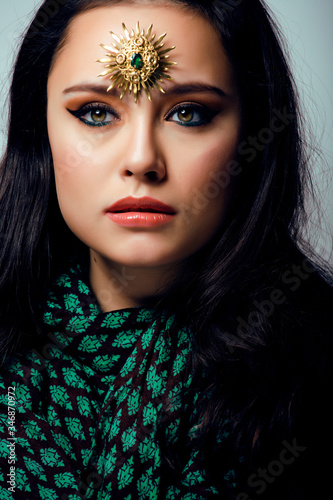 Fototapeta Naklejka Na Ścianę i Meble -  beauty eastern real muslim woman with jewelry close up, bride with star creative makeup