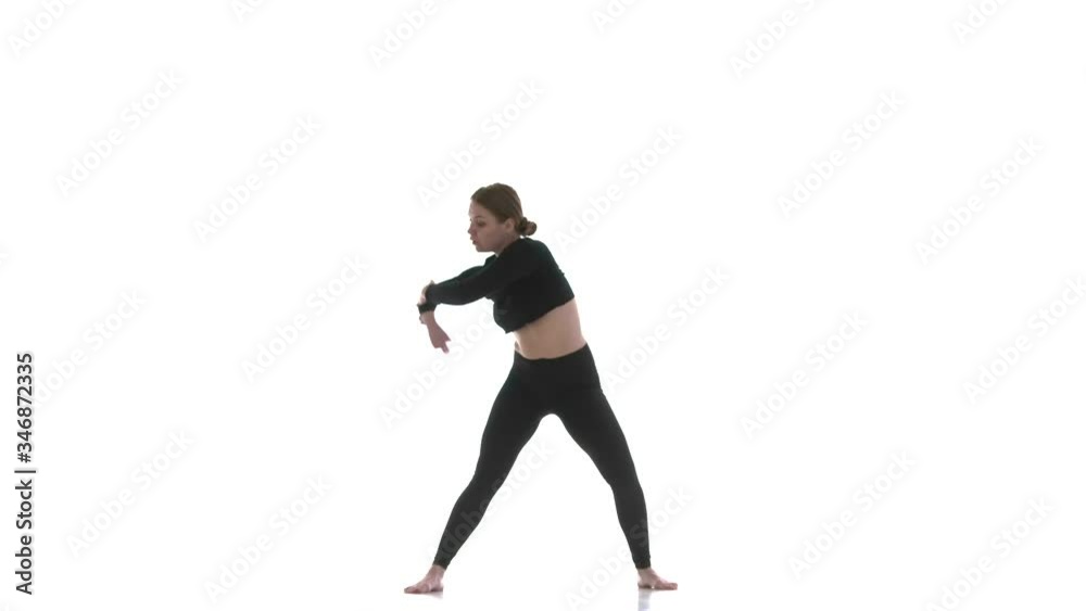 young beautiful girl dancer in black short top and black leggings dancing contemporary, modern ballet dance, isolated, slow motion young beautiful girl dancer in black short top and black leggings dancing contemporary, modern ballet dance, isolated, slow motion
